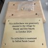 Brass pate with holes in Oak plinth for fixings